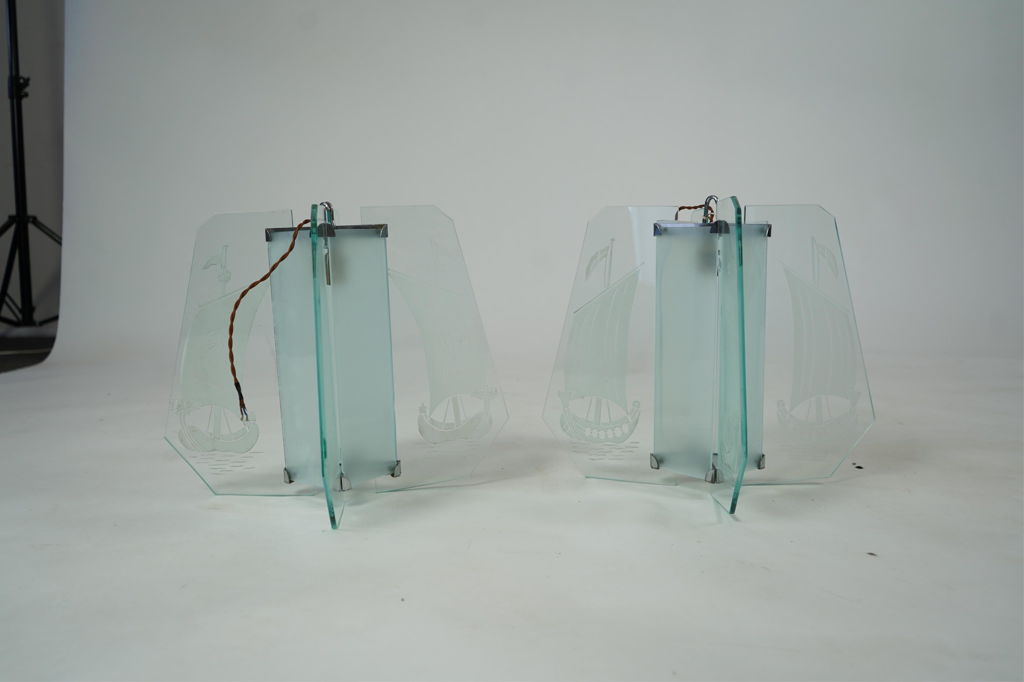 A pair of Art Deco chrome and four panelled etched glass ‘Galleon’ designed celling pendant lights